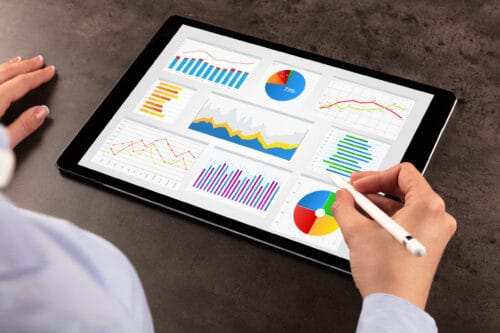 Business woman making reports on tablet